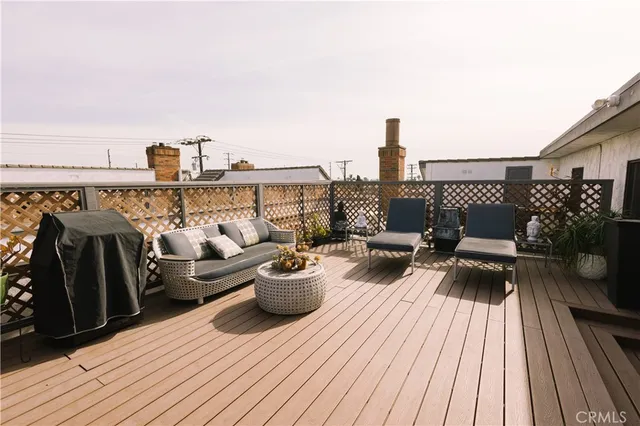 a view of roof deck with seating space