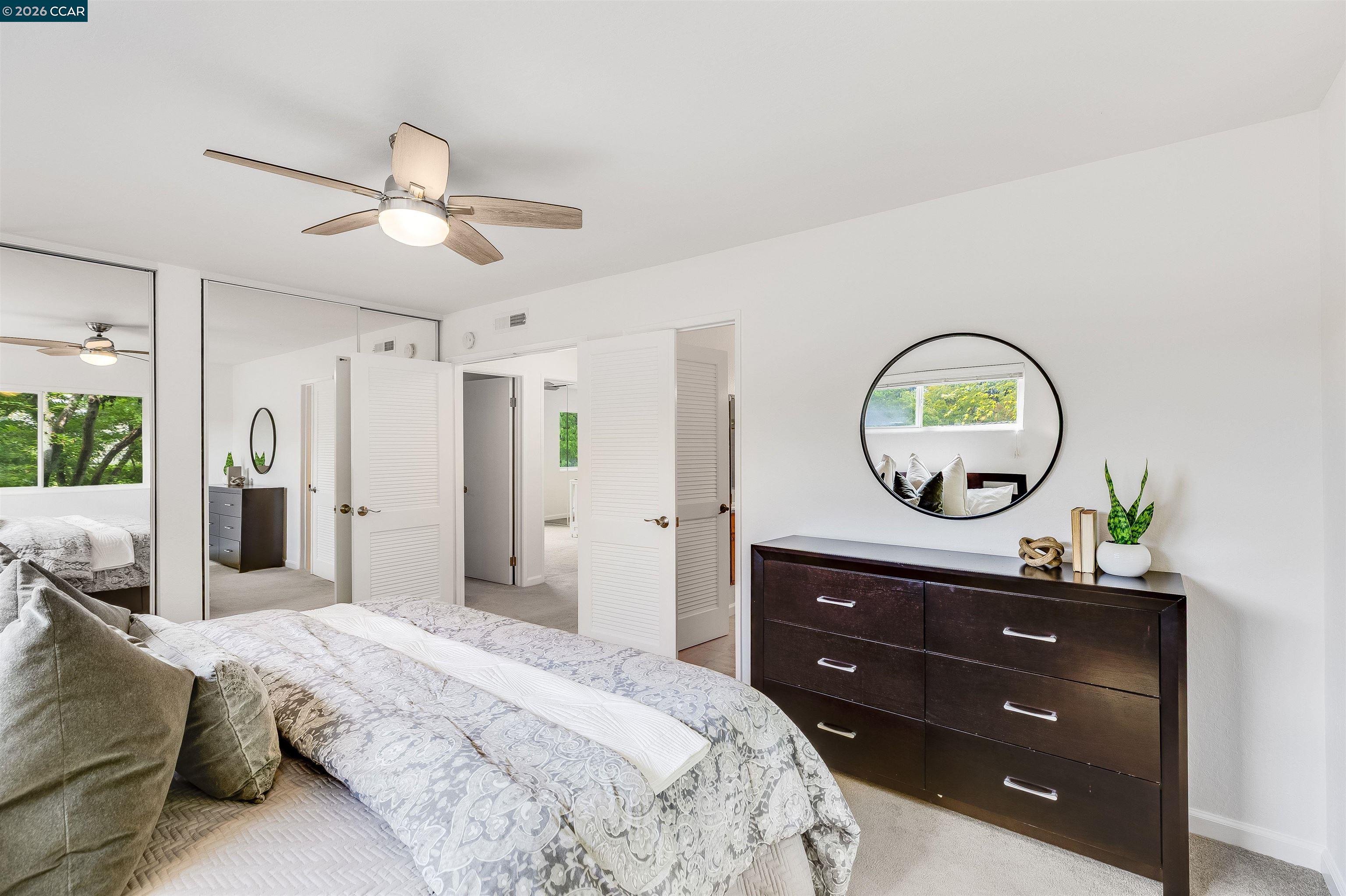 418 Devon Court San Ramon, CA 94583 - Photo 36 of 62 a bedroom with a bed and a mirror