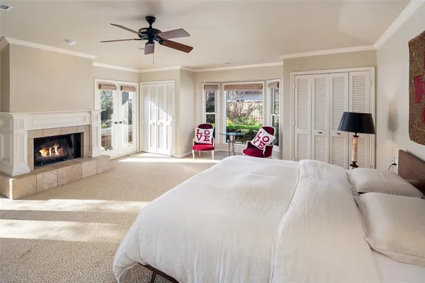 a bedroom with a bed and a fireplace