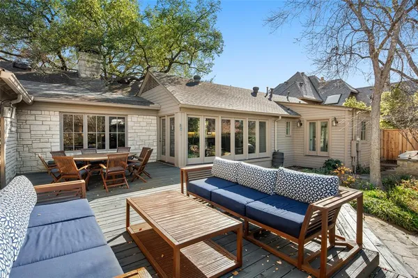 a view of a patio with couple of couches and chairs