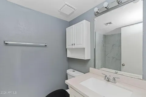 a bathroom with a sink and mirror