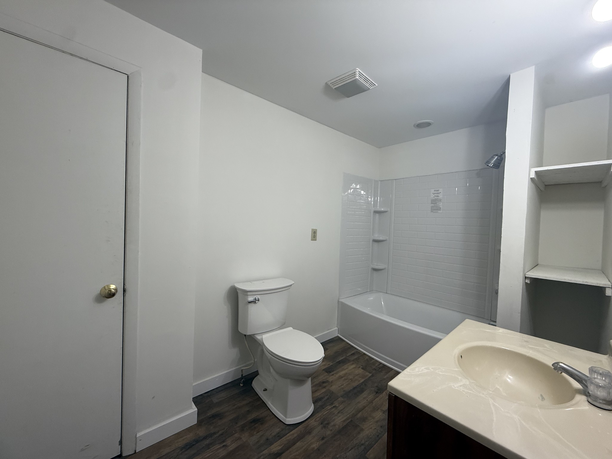 209 West 3rd Avenue Hohenwald, TN 38462 - Photo 11 of 12 a bathroom with a sink a toilet and shower