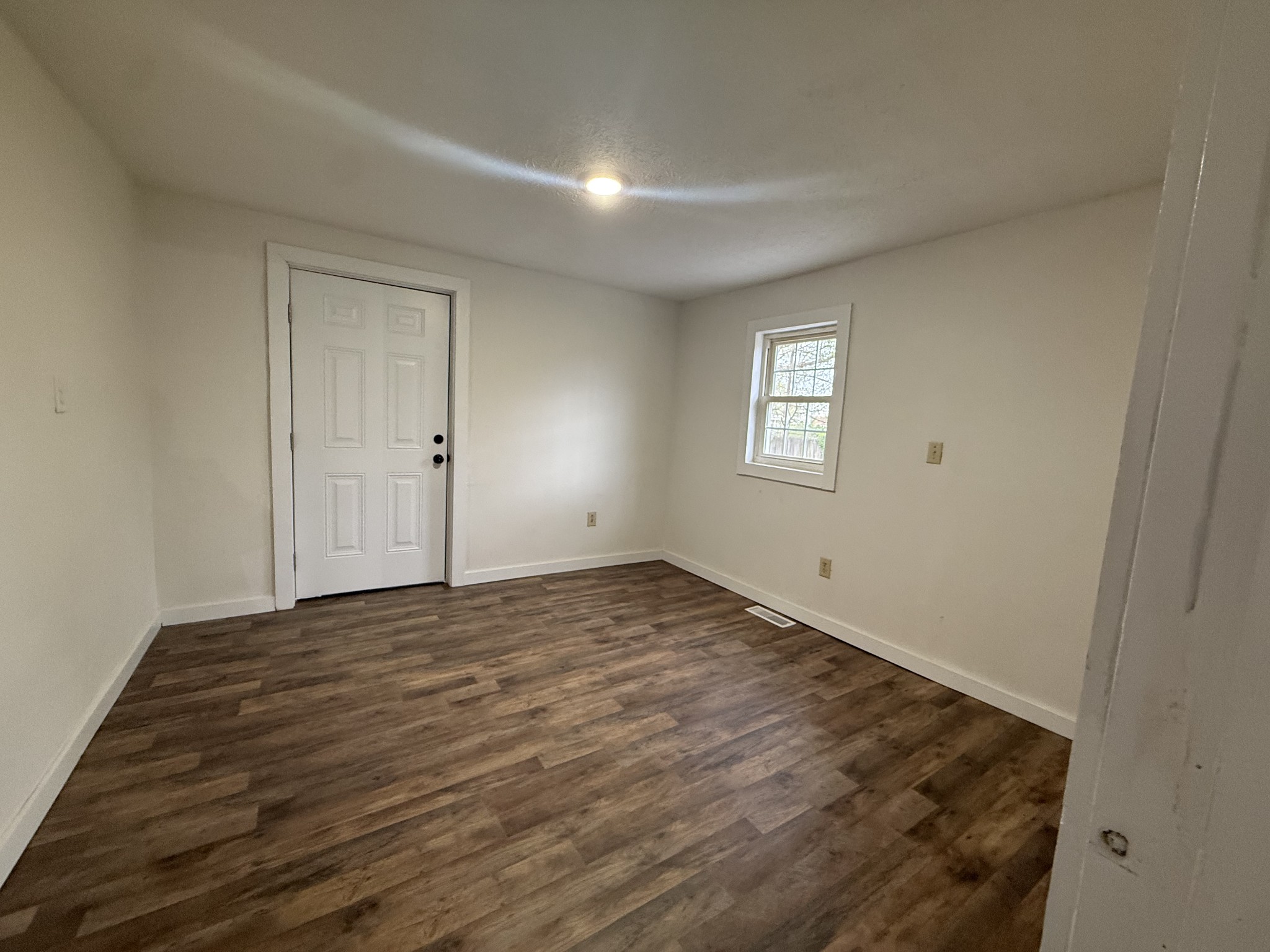 209 West 3rd Avenue Hohenwald, TN 38462 - Photo 8 of 12 a view of an empty room and window