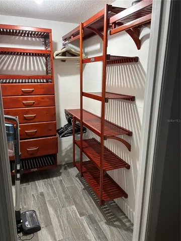 a view of a room with stairs and a wooden floor