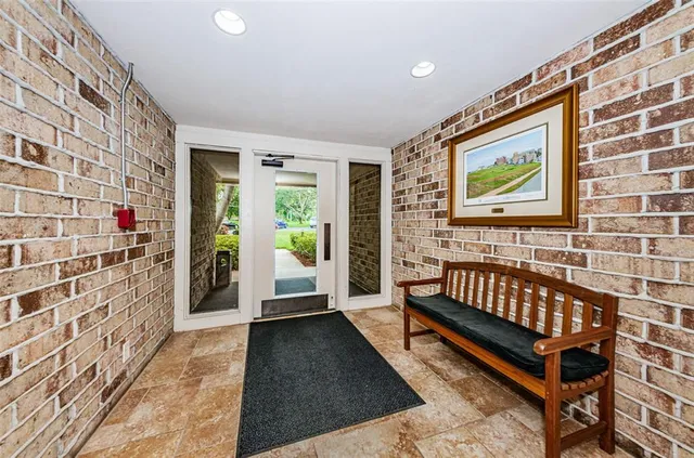 a view of a balcony with furniture and garden