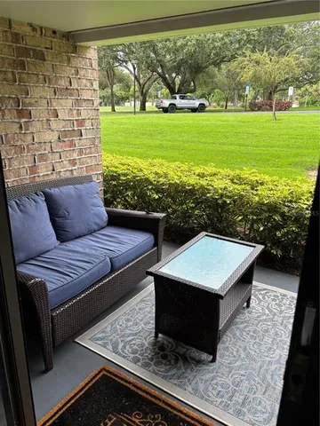 a view of a sitting area with furniture