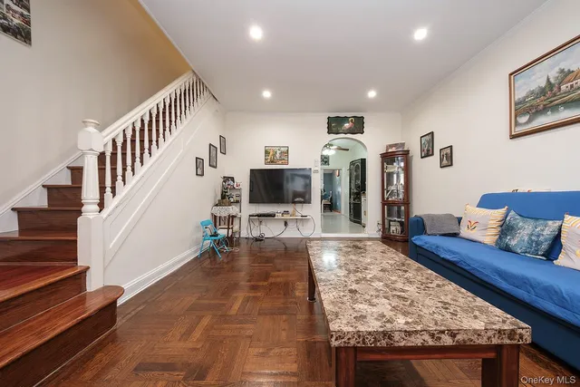 a living room with furniture and a rug
