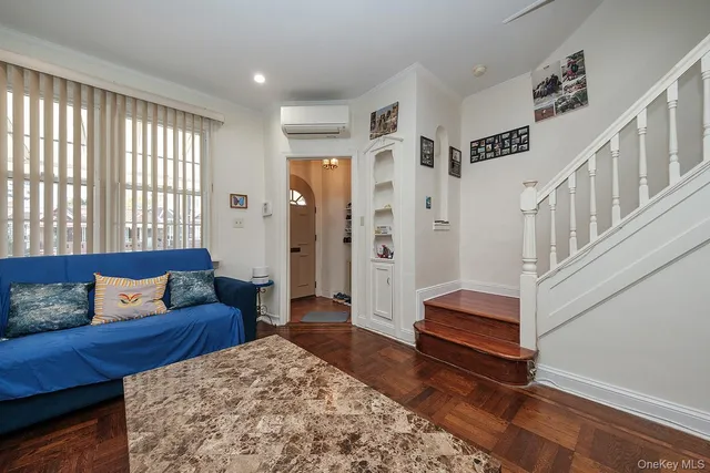 a living room with furniture and a rug