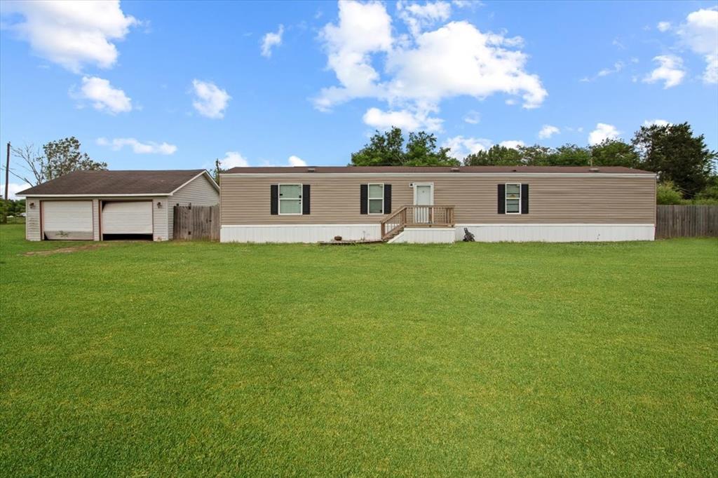 30 Galley Drive Denison, TX 75021 - Photo 1 of 18 a front view of a house with a yard and trees