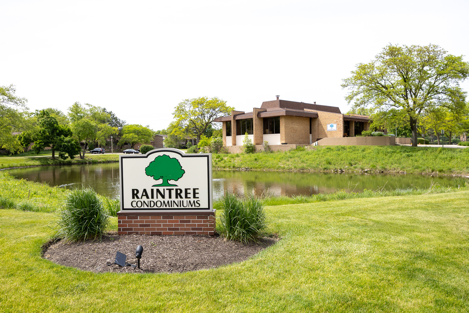 450 Raintree Court, Unit 2B Glen Ellyn, IL 60137 - Photo 24 of 28 a view of a house with a yard