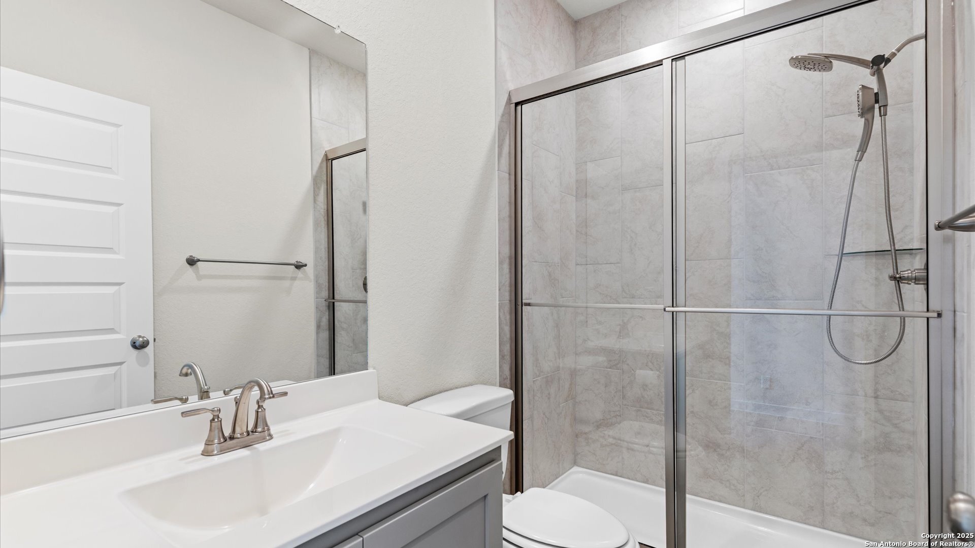 1551 Terrys Gate Road New Braunfels, TX 78132 - Photo 15 of 32 a bathroom with a sink toilet and shower