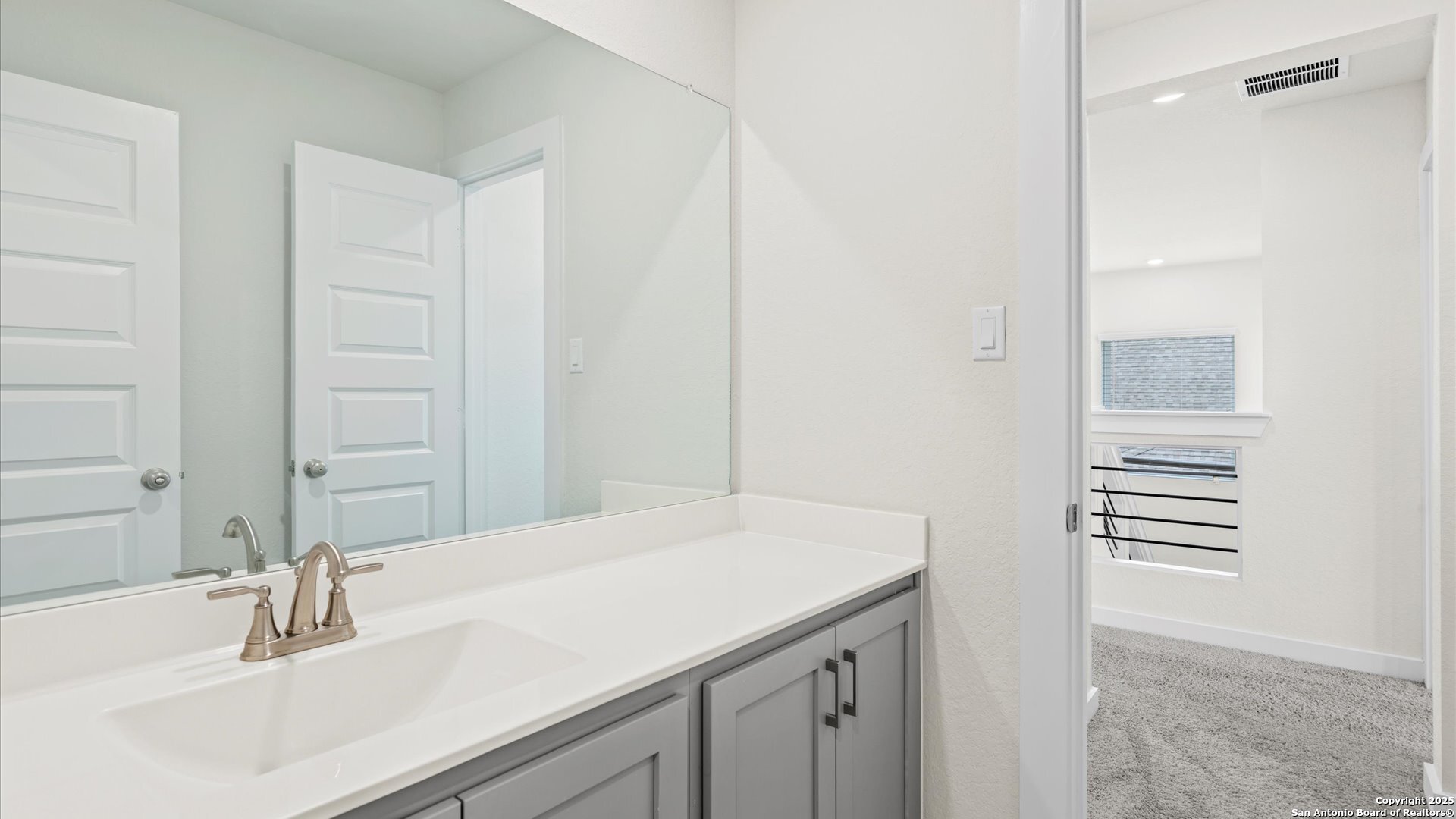 1551 Terrys Gate Road New Braunfels, TX 78132 - Photo 17 of 32 a bathroom with a sink and a mirror