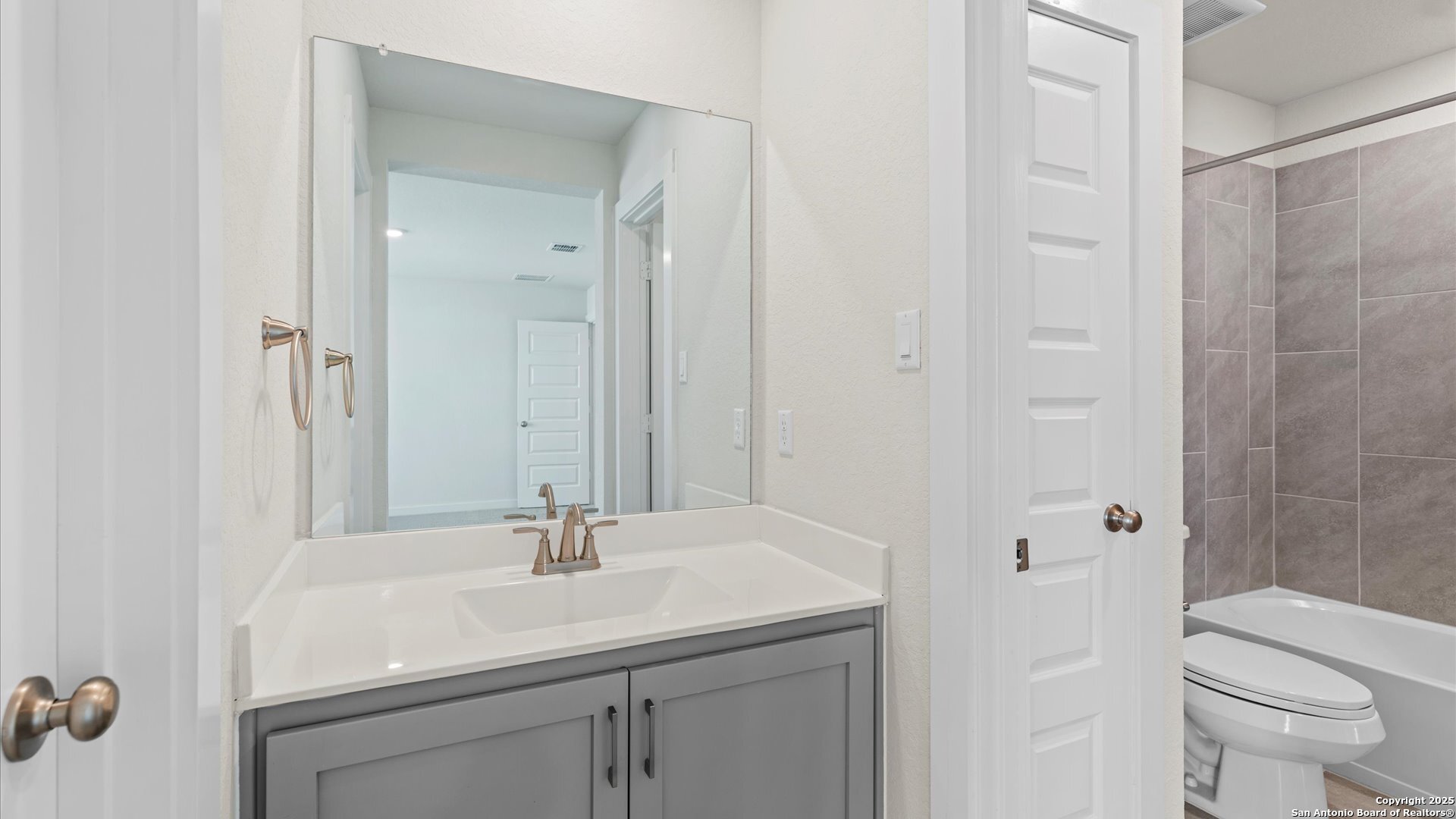 1551 Terrys Gate Road New Braunfels, TX 78132 - Photo 18 of 32 a bathroom with a sink toilet and shower