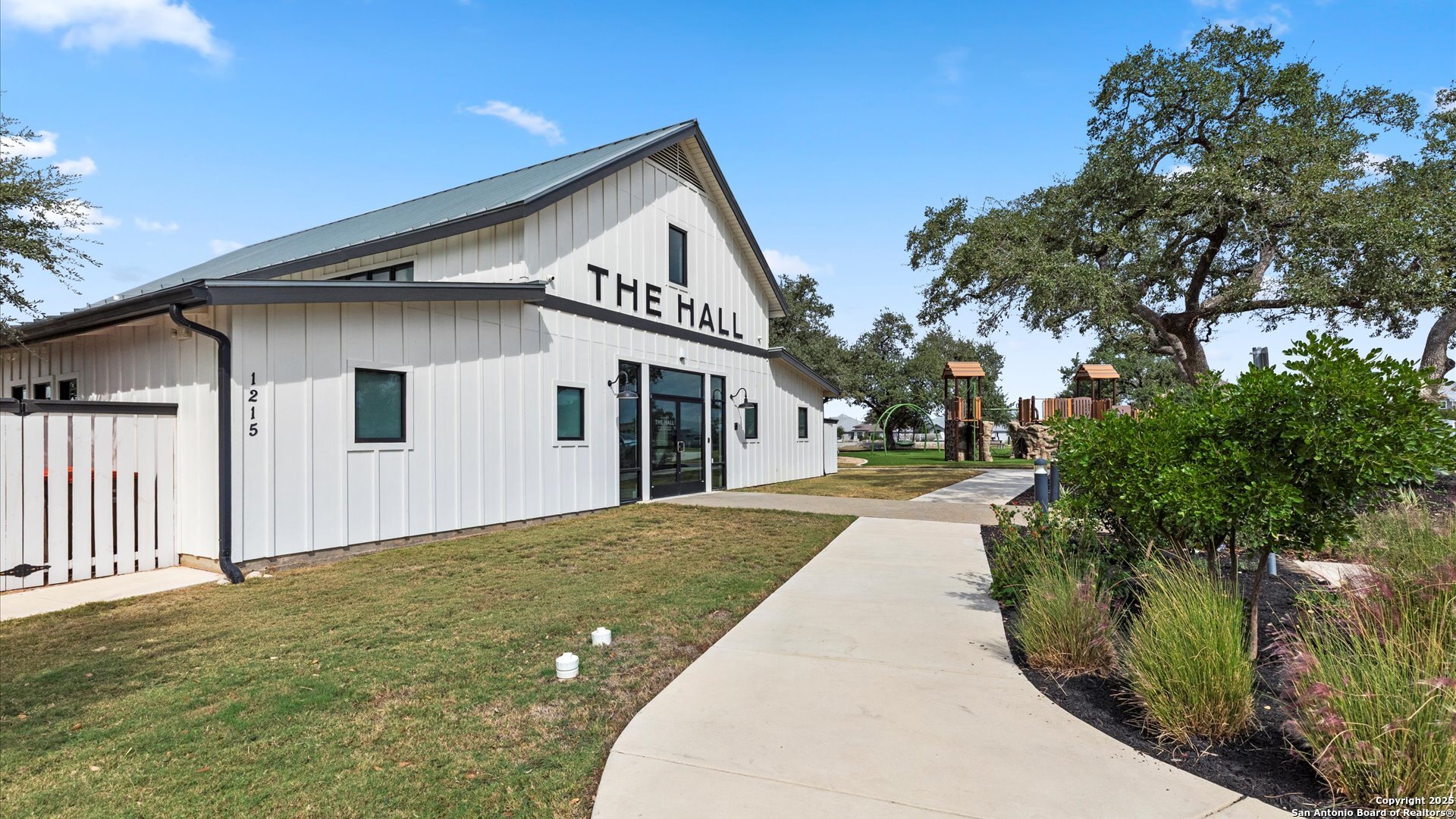 1551 Terrys Gate Road New Braunfels, TX 78132 - Photo 25 of 32 a front view of a house with a yard and trees