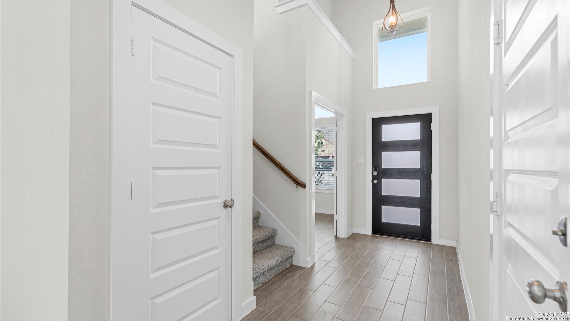 1551 Terrys Gate Road New Braunfels, TX 78132 - Photo 3 of 32 a view of entryway with stairs and wooden floor