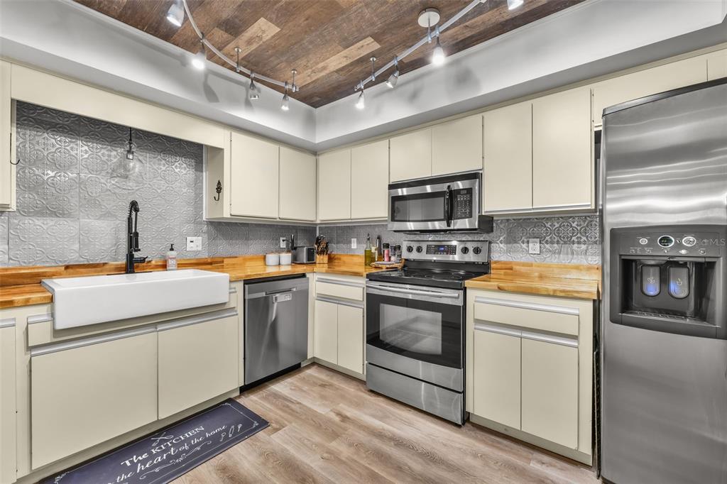 457 East Highland Street Altamonte Springs, FL 32701 - Photo 11 of 55 a kitchen with a sink cabinets and stainless steel appliances