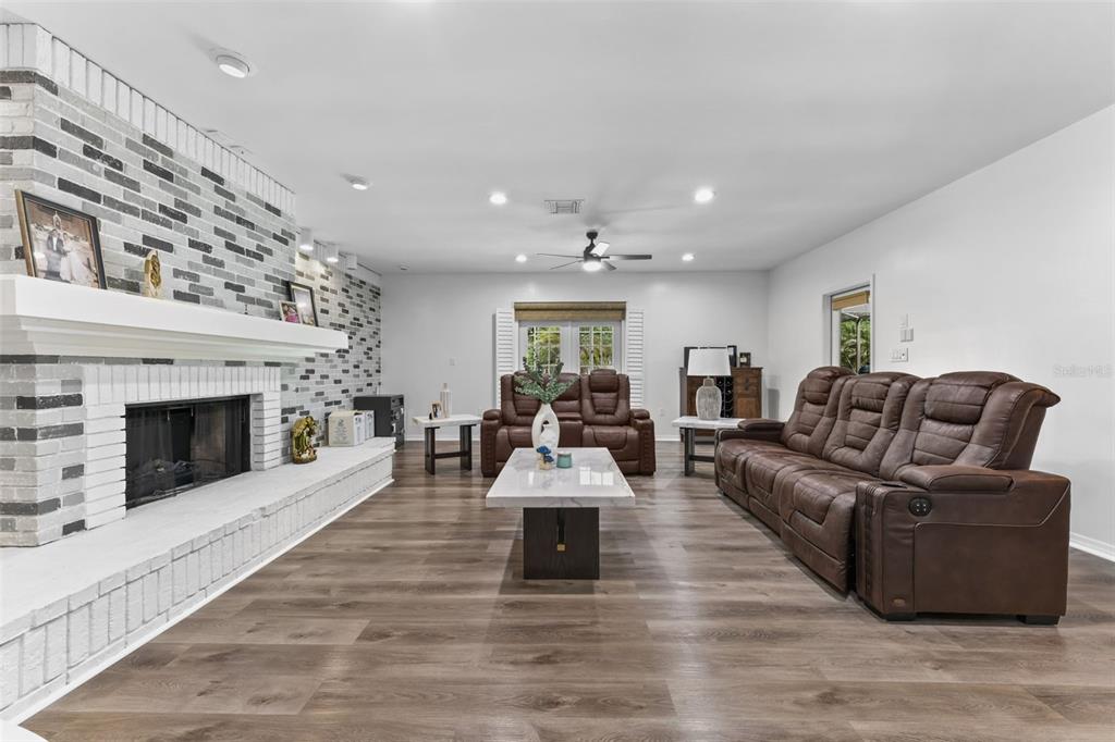 457 East Highland Street Altamonte Springs, FL 32701 - Photo 15 of 55 a living room with furniture and a fireplace