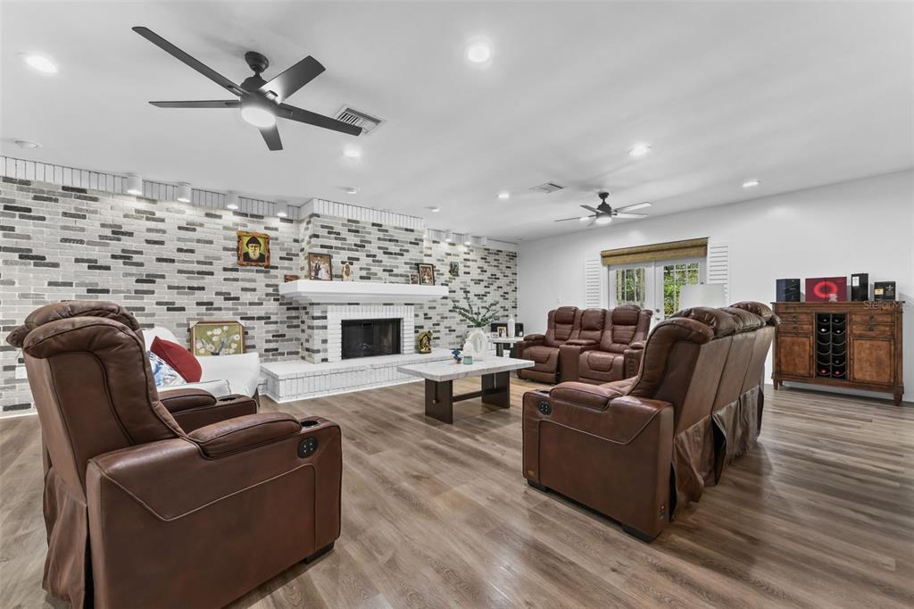 457 East Highland Street Altamonte Springs, FL 32701 - Photo 16 of 55 a living room with furniture wooden floor and a fireplace