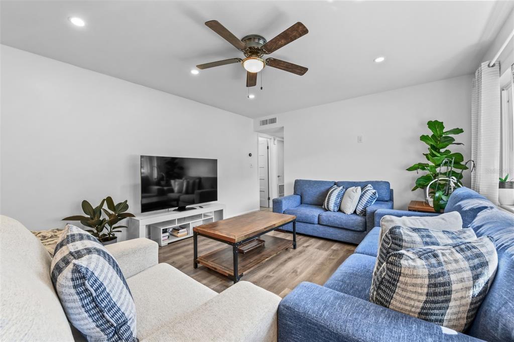 457 East Highland Street Altamonte Springs, FL 32701 - Photo 22 of 55 a living room with furniture and a flat screen tv