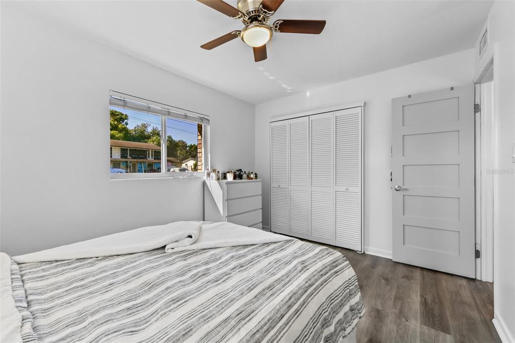 457 East Highland Street Altamonte Springs, FL 32701 - Photo 30 of 55 a bedroom with a bed and a chandelier