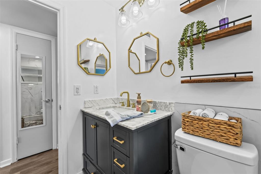 457 East Highland Street Altamonte Springs, FL 32701 - Photo 32 of 55 a bathroom with a sink and a mirror