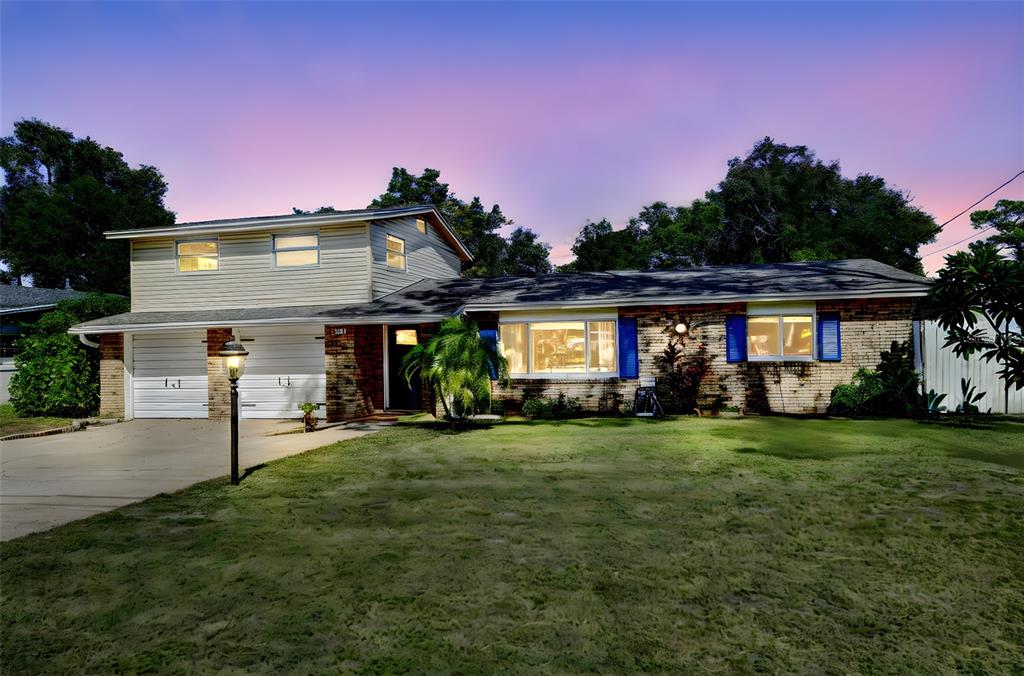 457 East Highland Street Altamonte Springs, FL 32701 - Photo 50 of 55 a front view of a house with a yard