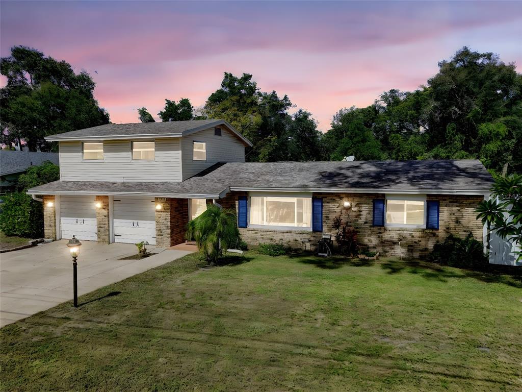 457 East Highland Street Altamonte Springs, FL 32701 - Photo 51 of 55 a front view of a house with a yard