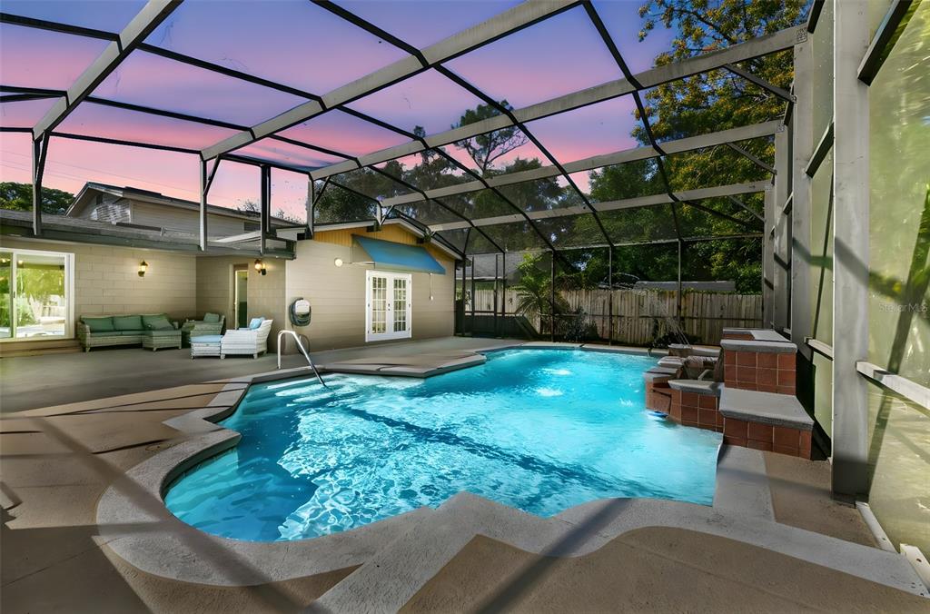 457 East Highland Street Altamonte Springs, FL 32701 - Photo 52 of 55 a backyard of a house with barbeque oven table and chairs