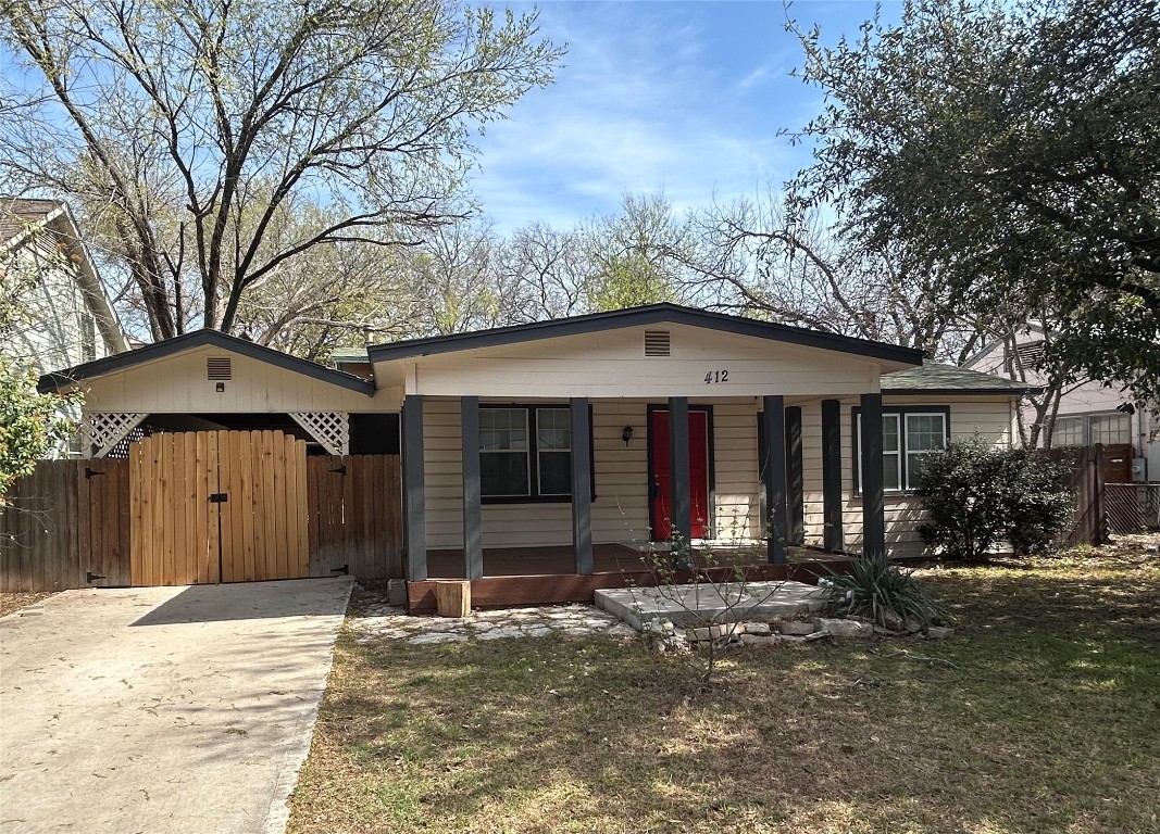 412 Kenniston Drive Austin, TX 78752 - Photo 1 of 1 a front view of a house with garden