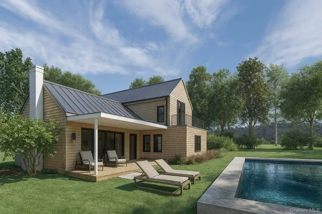 a view of a house with backyard porch and sitting area