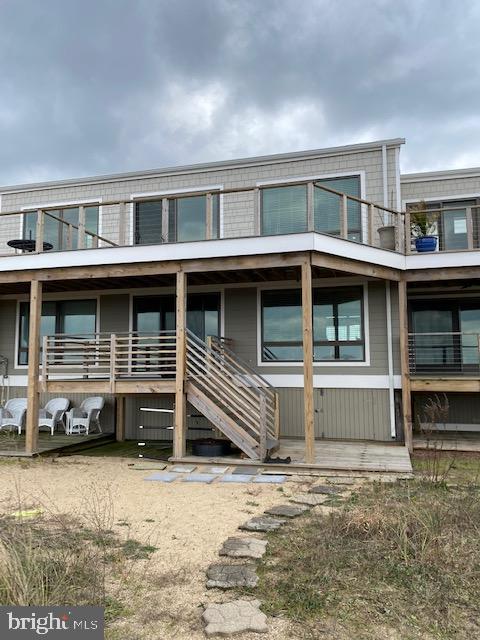 Home as it faces the bay-private path to the beach