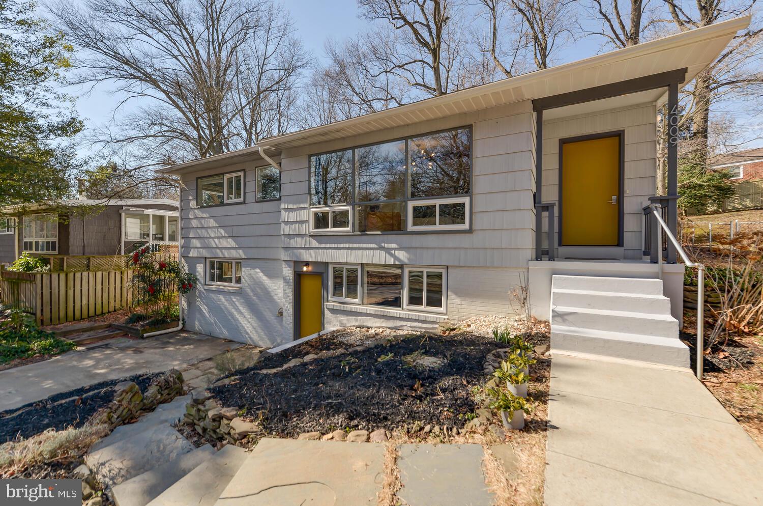 4009 Denfeld Avenue Kensington, MD 20895 - Photo 1 of 48 a view of a house with a yard and windows