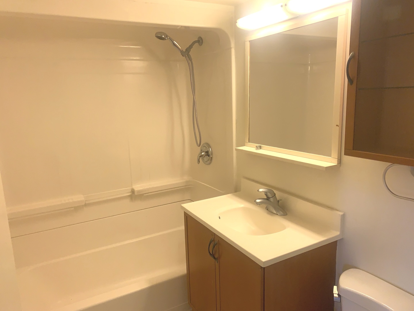 4347 West 63rd Street, Unit 2A Chicago, IL 60629 - Photo 12 of 15 a bathroom with a sink toilet and shower
