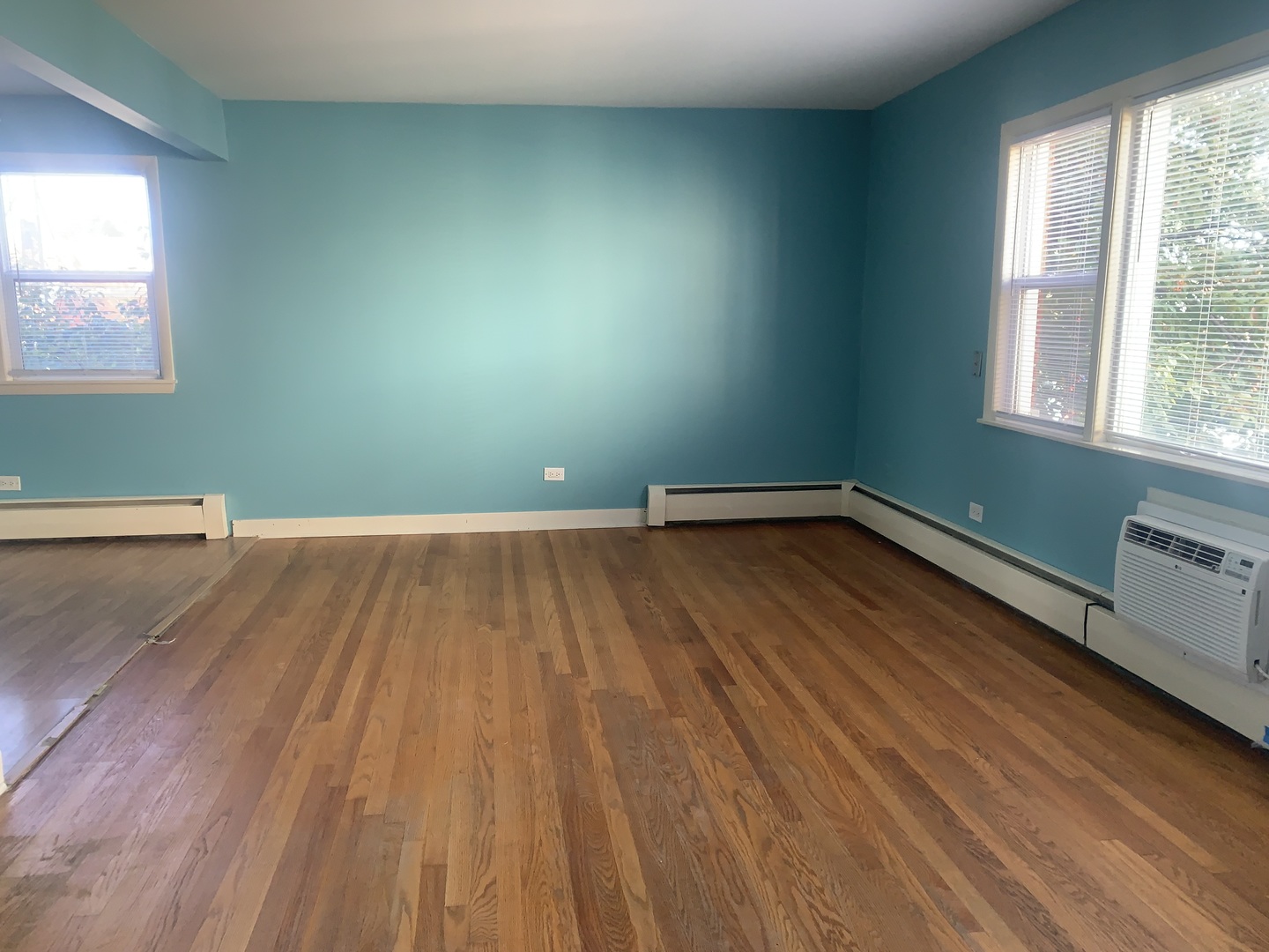 4347 West 63rd Street, Unit 2A Chicago, IL 60629 - Photo 3 of 15 a view of a room with wooden floor and windows