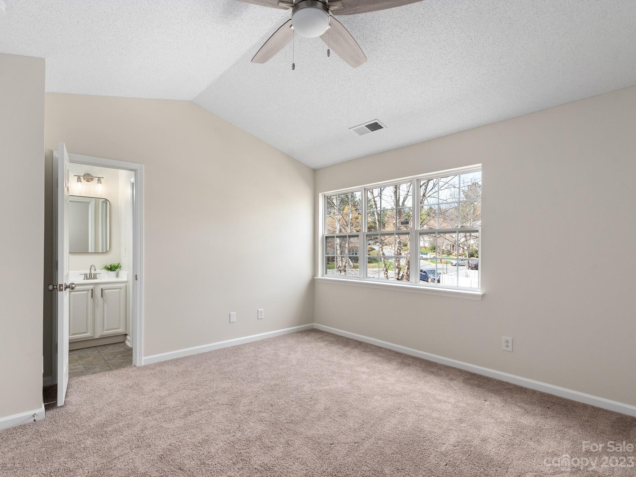 8158 Rudolph Road Charlotte, NC 28216 - Photo 12 of 23 a view of an empty room with a window