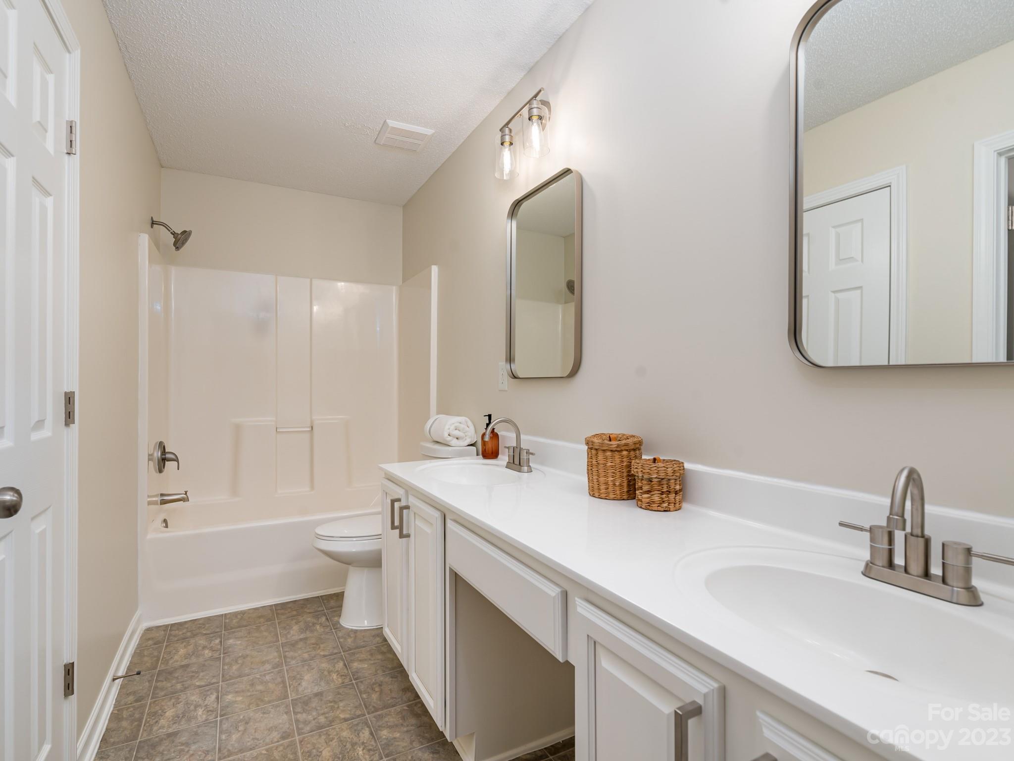 8158 Rudolph Road Charlotte, NC 28216 - Photo 13 of 23 a bathroom with a sink and a mirror