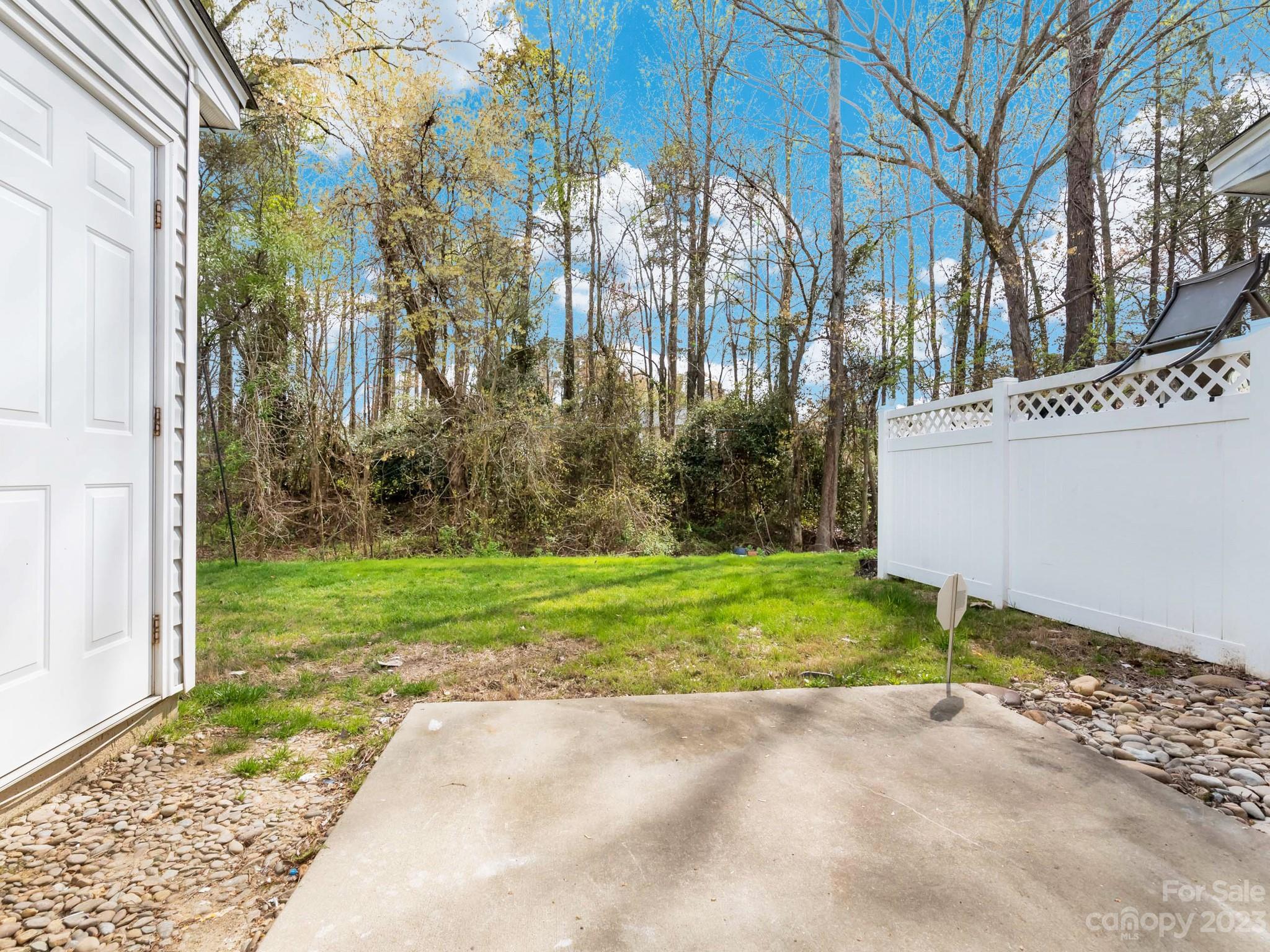8158 Rudolph Road Charlotte, NC 28216 - Photo 16 of 23 a view of a house with a yard and pathway