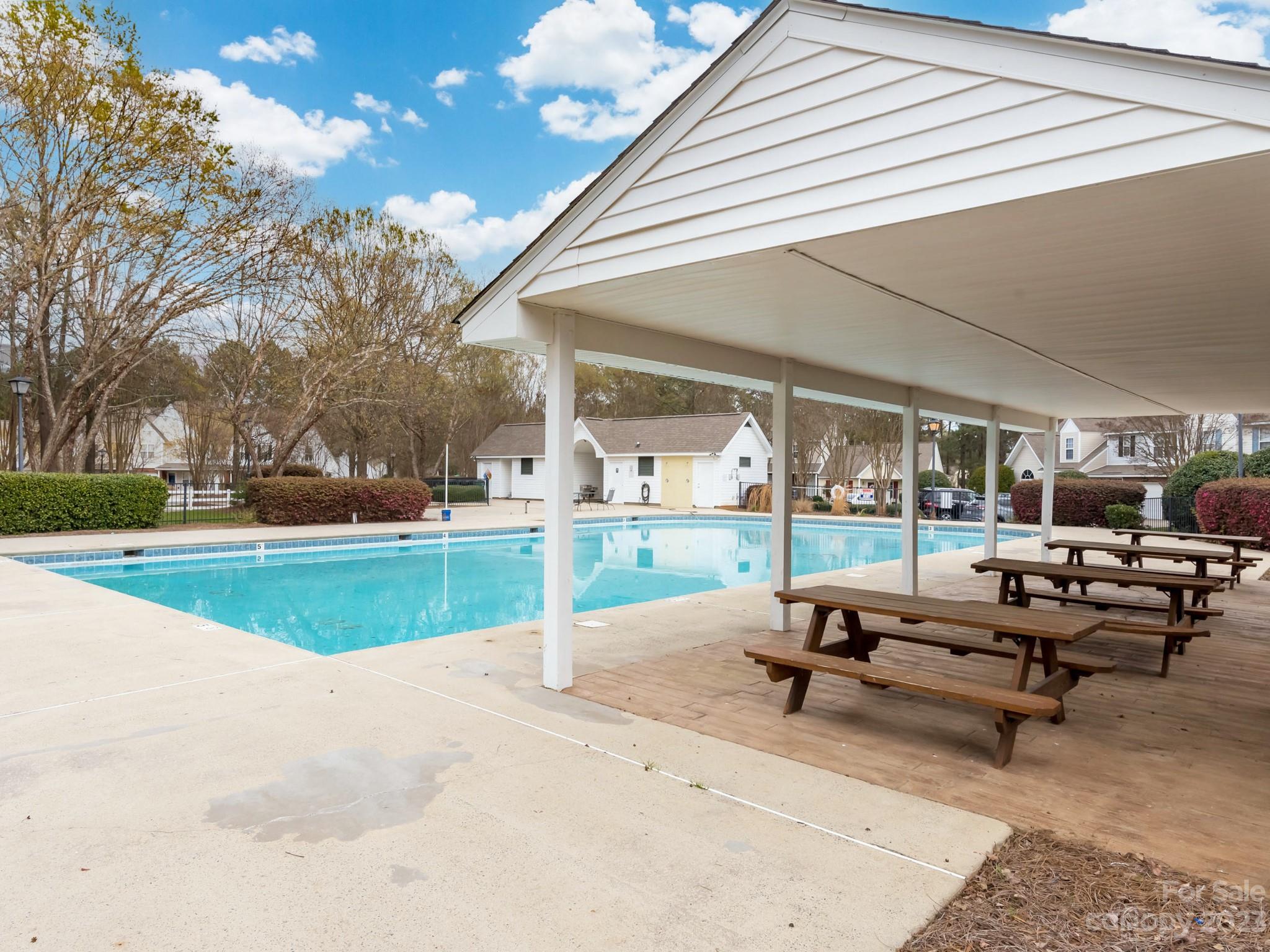 8158 Rudolph Road Charlotte, NC 28216 - Photo 19 of 23 a view of a patio with a table and chairs under an umbrella