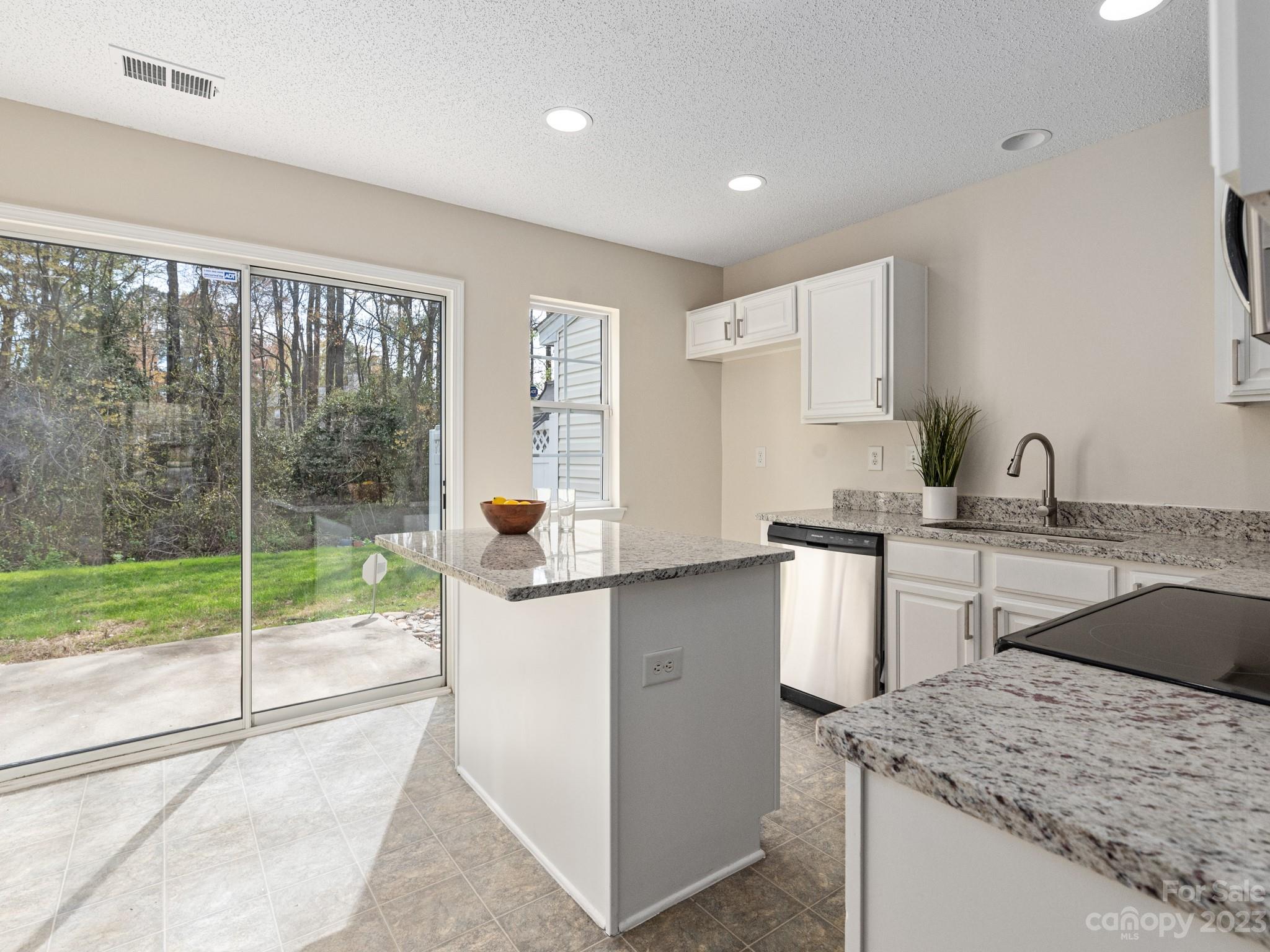 8158 Rudolph Road Charlotte, NC 28216 - Photo 9 of 23 a kitchen with a sink and refrigerator