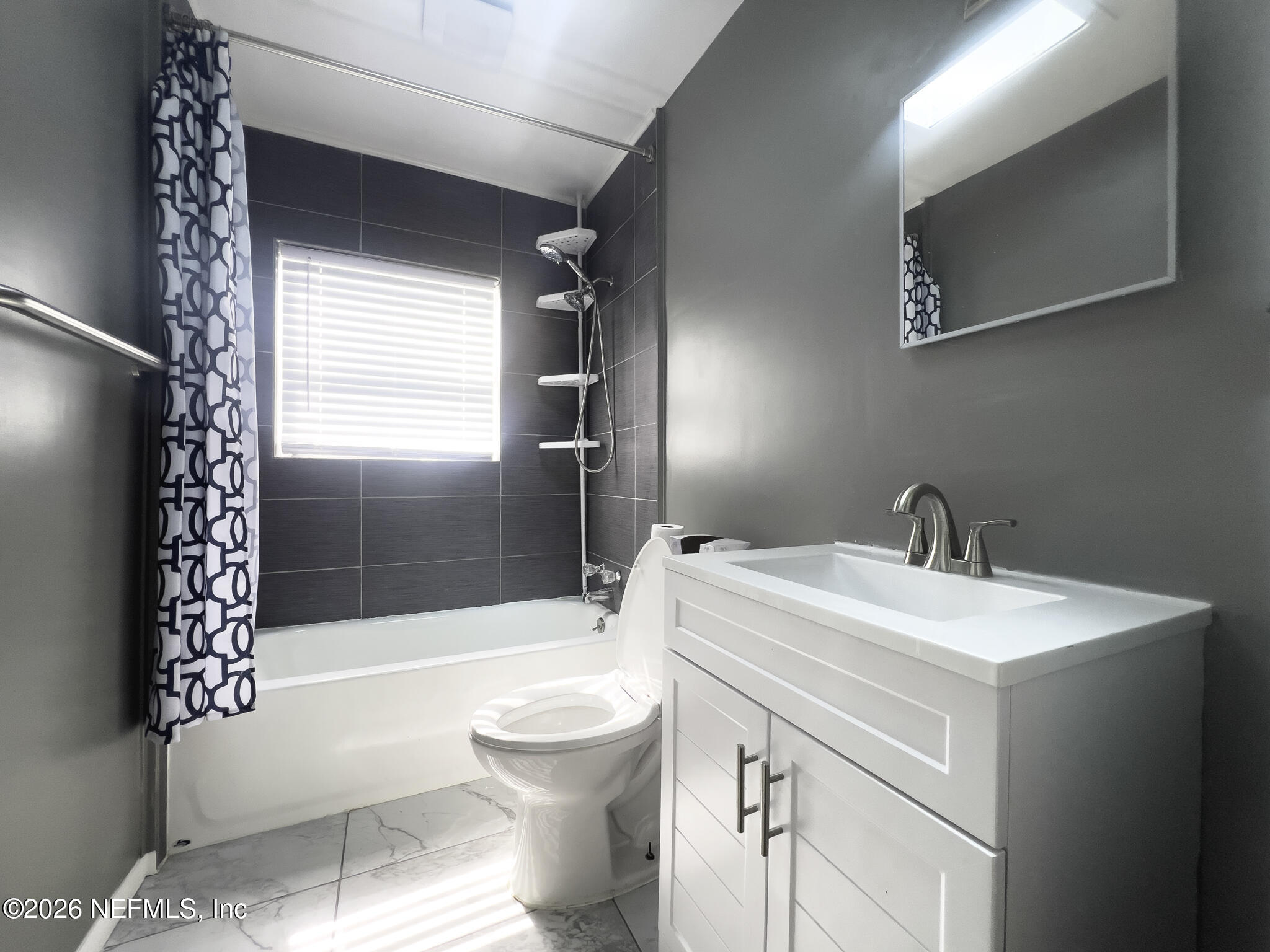 2085 Mills Road Jacksonville, FL 32216 - Photo 6 of 13 a bathroom with a sink toilet and shower