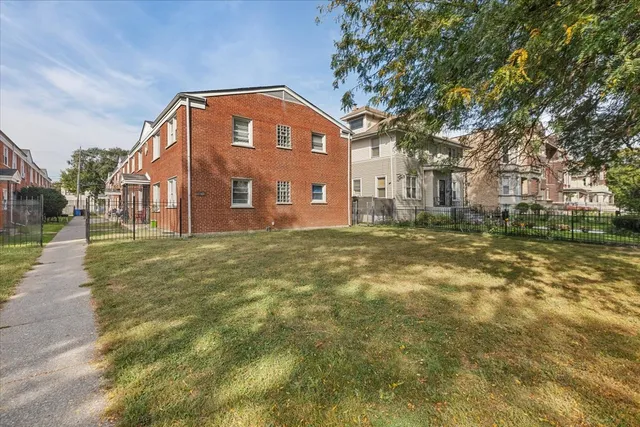 a view of a building with a yard