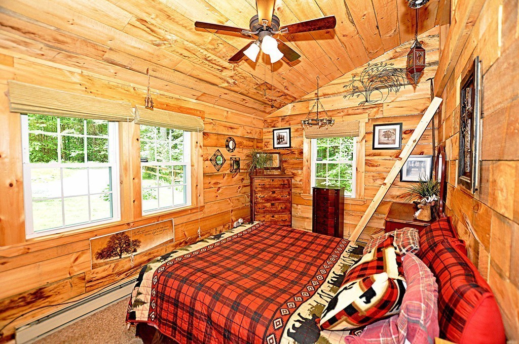 153 Sir Walter Road Becket, MA 01223 - Photo 9 of 15 a bedroom with a bed and a window