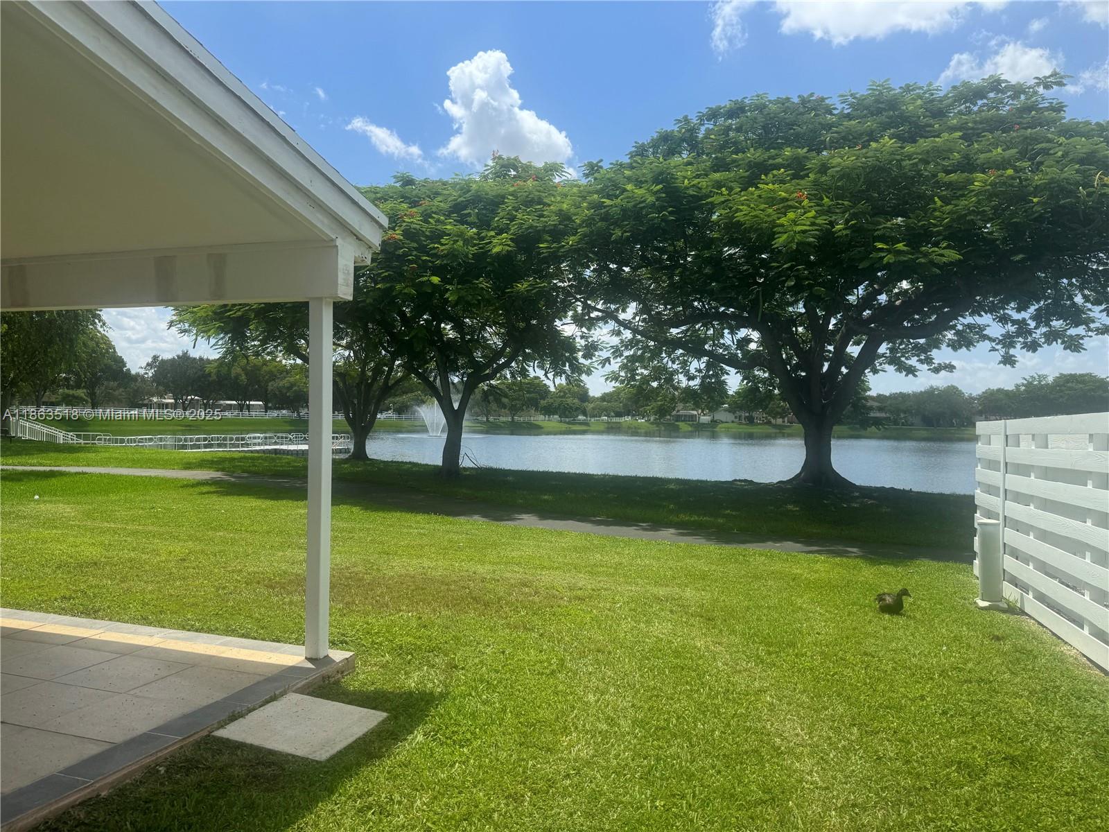 14570 Southwest 145th Place, Unit 14570 Miami, FL 33186 - Photo 17 of 23 a view of a park with large trees