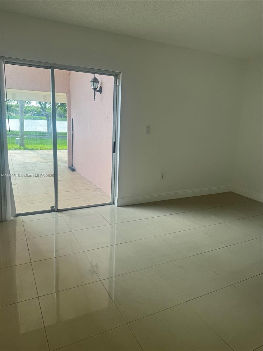14570 Southwest 145th Place, Unit 14570 Miami, FL 33186 - Photo 3 of 23 a bathroom with a shower