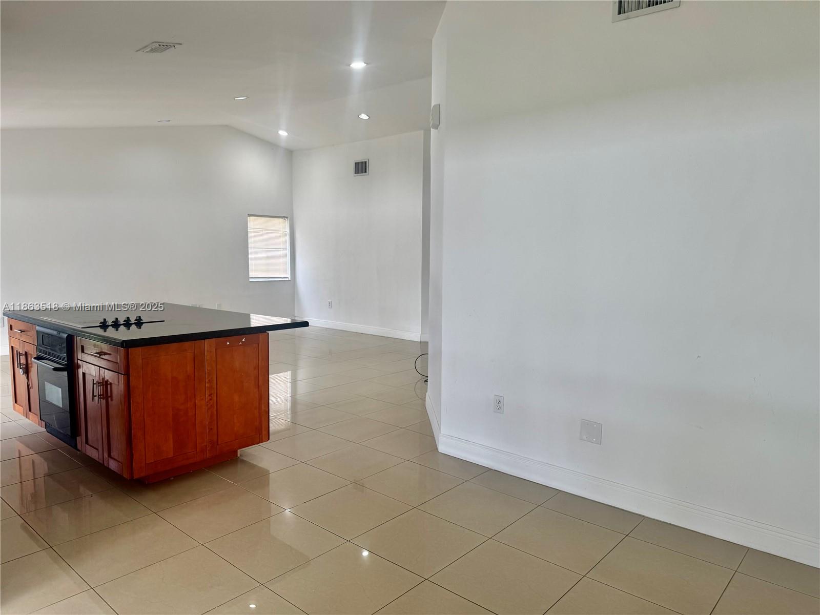 14570 Southwest 145th Place, Unit 14570 Miami, FL 33186 - Photo 10 of 23 a view of a storage & utility room with windows