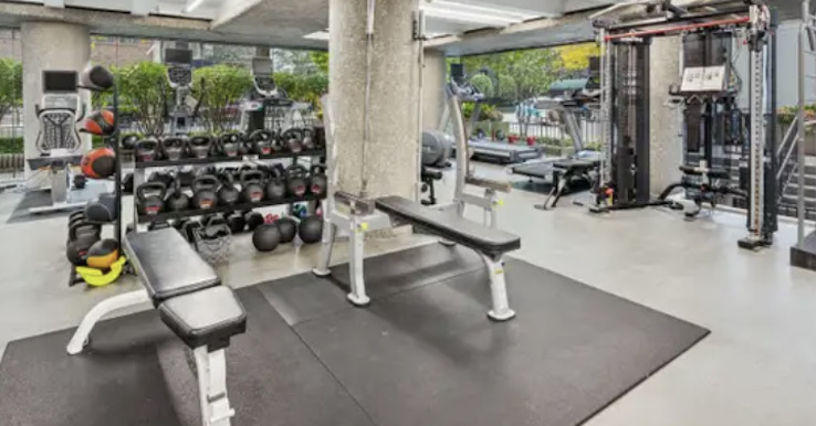 200 East Delaware Place, Unit 19A Chicago, IL 60611 - Photo 12 of 17 an room with gym equipment