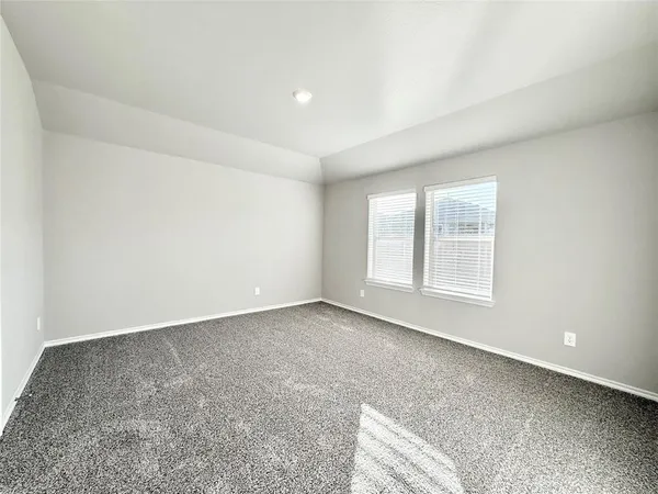an empty room with a empty space and window