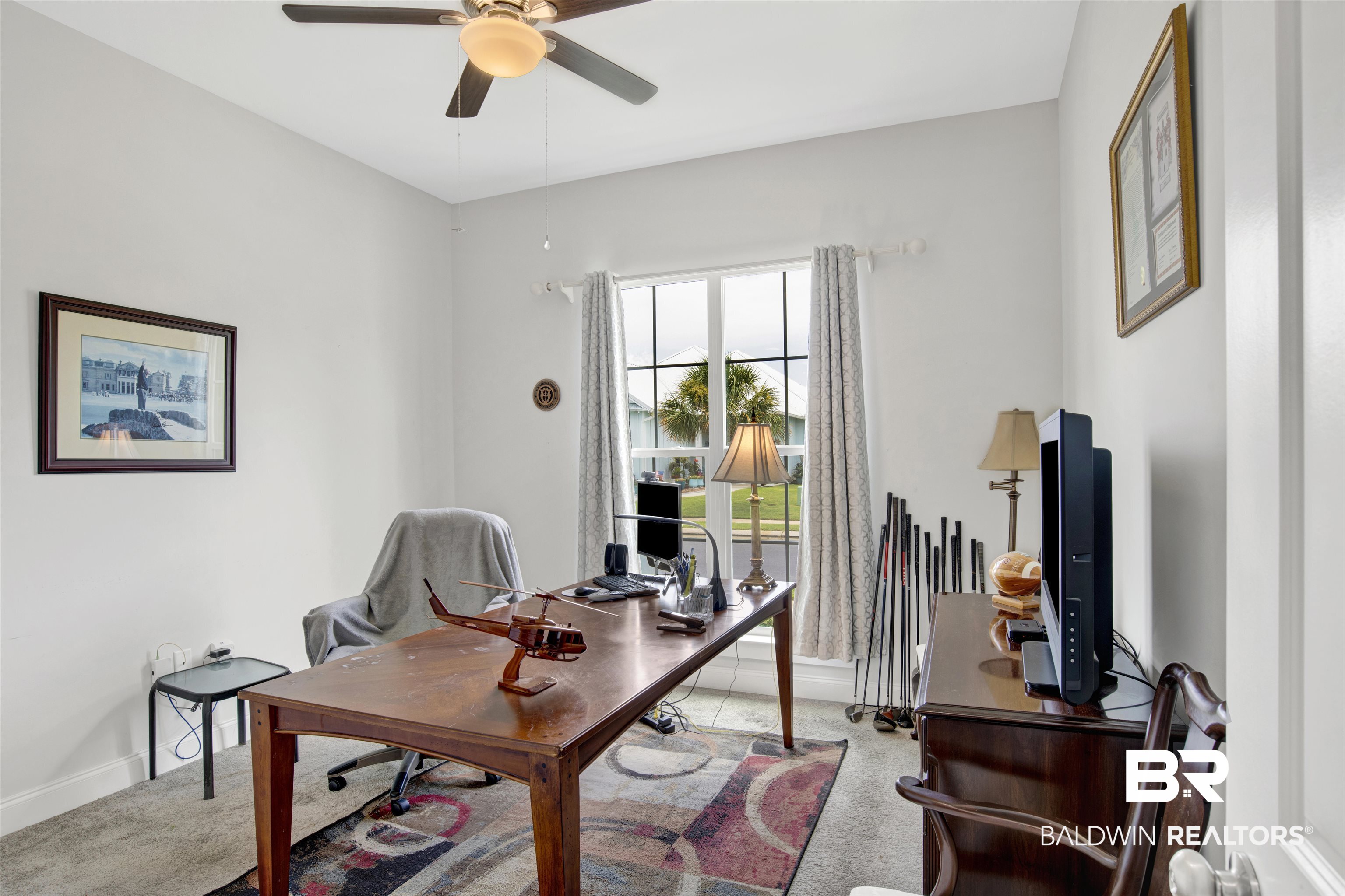 23893 Cypress Crossing Orange Beach, AL 36561 - Photo 8 of 22 Carpeted home office with a ceiling fan and baseboards