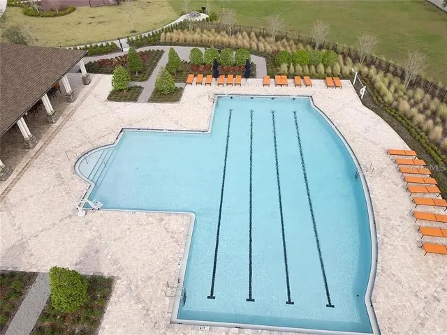 swimming pool view with a lake view