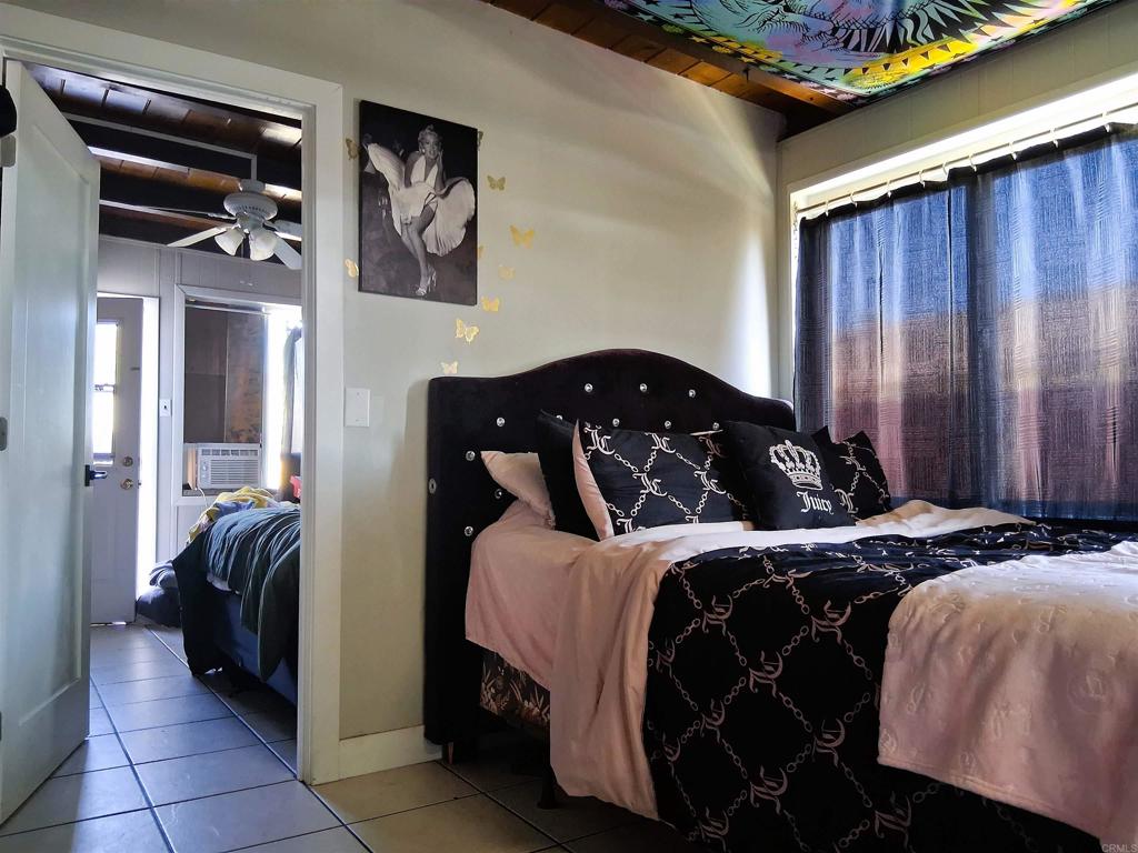 101 Lancer Avenue Oceanside, CA 92058 - Photo 6 of 17 a bedroom with a bed and a window